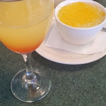 Metro Diner - Mixed mimosa and cheese grits. - American Near Me - Charlotte, North Carolina Metro Diner - Mixed mimosa and cheese grits. - American Near Me - Charlotte, North Carolina