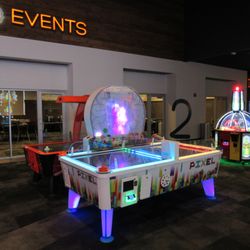 EVO Entertainment - Air Hockey in front of Event Room