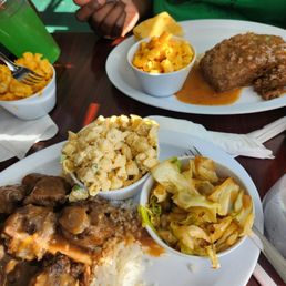 Oxtails dinner with cabbage and macaroni salad Oxtails dinner with cabbage and macaroni salad