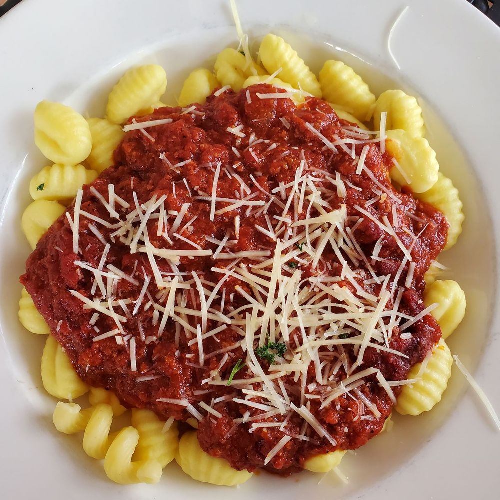 Capri di Nuovo - Gnocchi with meat sauce - Italian Near Me - West Allis, Wisconsin Capri di Nuovo - Gnocchi with meat sauce - Italian Near Me - West Allis, Wisconsin