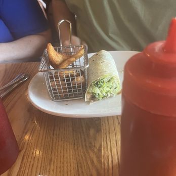Cafe 25:35 - Half eaten Cesar wrap with mostly eaten fries. Aren't the fry baskets clever? - American Near Me - Buckeye, Arizona