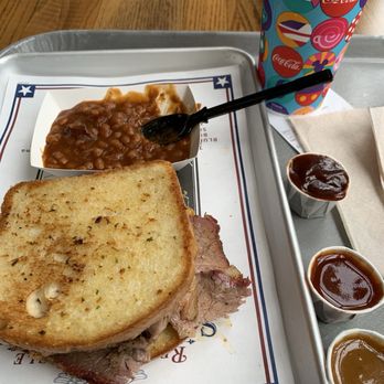 Regal Eagle Smokehouse: Craft Drafts & Barbecue - Brisket sandwich with beans. Very good. - Barbeque Near Me - Lake Buena Vista, Florida