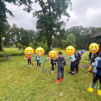 Heather Pearl - Kids trying bucket stilts and circus activities at rainy birthday party - Clowns Near Me Heather Pearl - Kids trying bucket stilts and circus activities at rainy birthday party - Clowns Near Me
