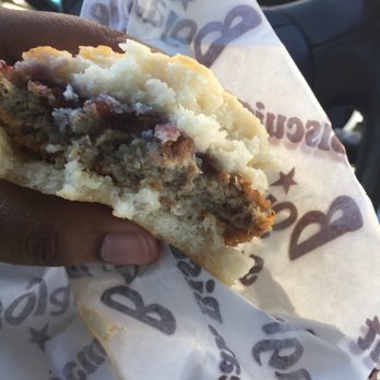 Bojangles - My hot and fresh steak biscuit already half eaten because I am so hungry. - Fast Food Near Me - Fairburn, Georgia