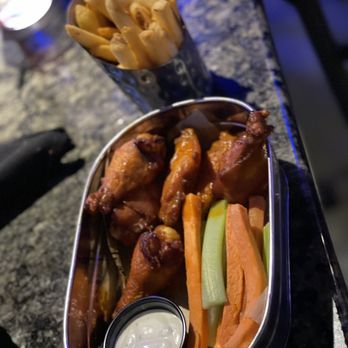 Topgolf - Buffalo Chicken Wings with fries - New American Near Me - Orlando, Florida Topgolf - Buffalo Chicken Wings with fries - New American Near Me - Orlando, Florida