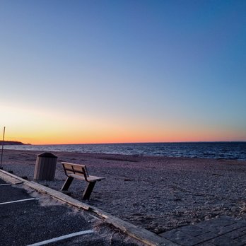 Sunsets at Cedar Beach - a bench on the beach - American Near Me - Mount Sinai, New York Sunsets at Cedar Beach - a bench on the beach - American Near Me - Mount Sinai, New York