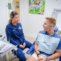 Schneider Family Dentistry - hygienist discussion care with patient