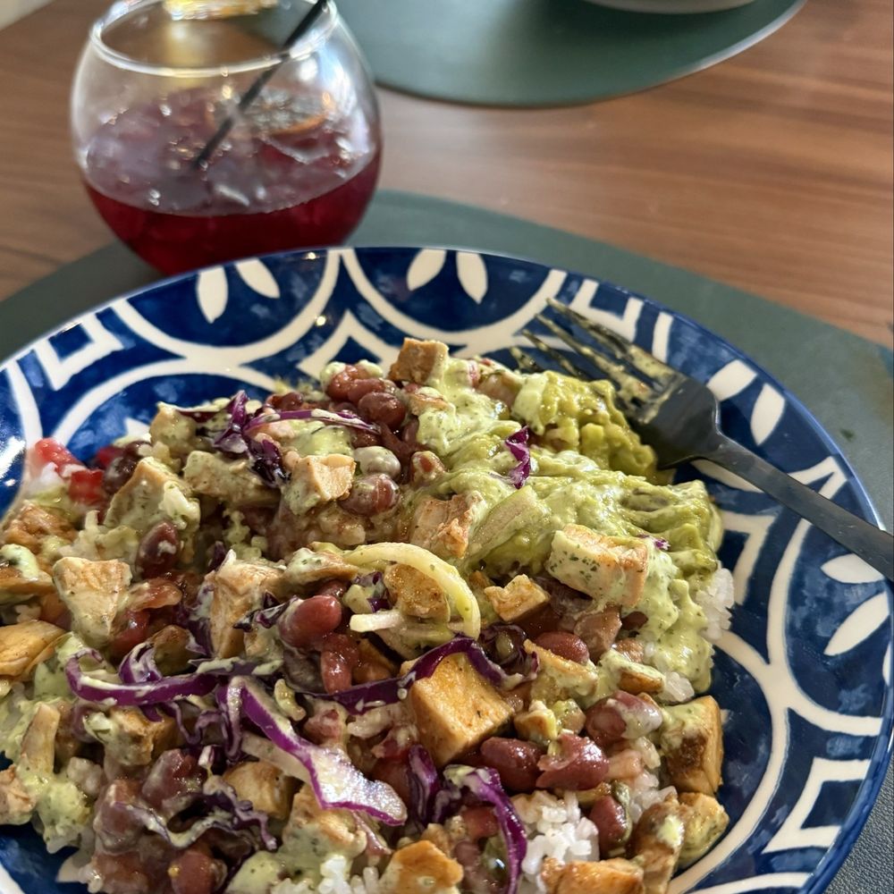 Santana's Kitchen and Cocktails - Entrees: Chicken Bowl and Fuego y Elote and a delicious Ruby Red Sangria - Latin American Near Me - Delray Beach, Florida
