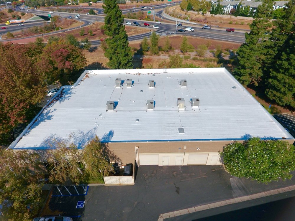 Slide of Flat Roofing Pros