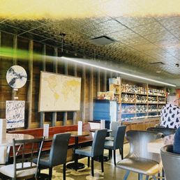 a man sitting at a table in a restaurant a man sitting at a table in a restaurant