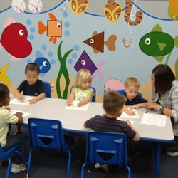 My Great Beginnings Learning Center - One on one teacher interaction with children while teaching a lesson.