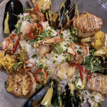 Pacific Table - Chef's creation. This was clams, scallops, shrimp, white fish over a bed of delicious coconut curry rice. - Sushi Bars Near Me - Fort Worth, Texas Pacific Table - Chef's creation. This was clams, scallops, shrimp, white fish over a bed of delicious coconut curry rice. - Sushi Bars Near Me - Fort Worth, Texas