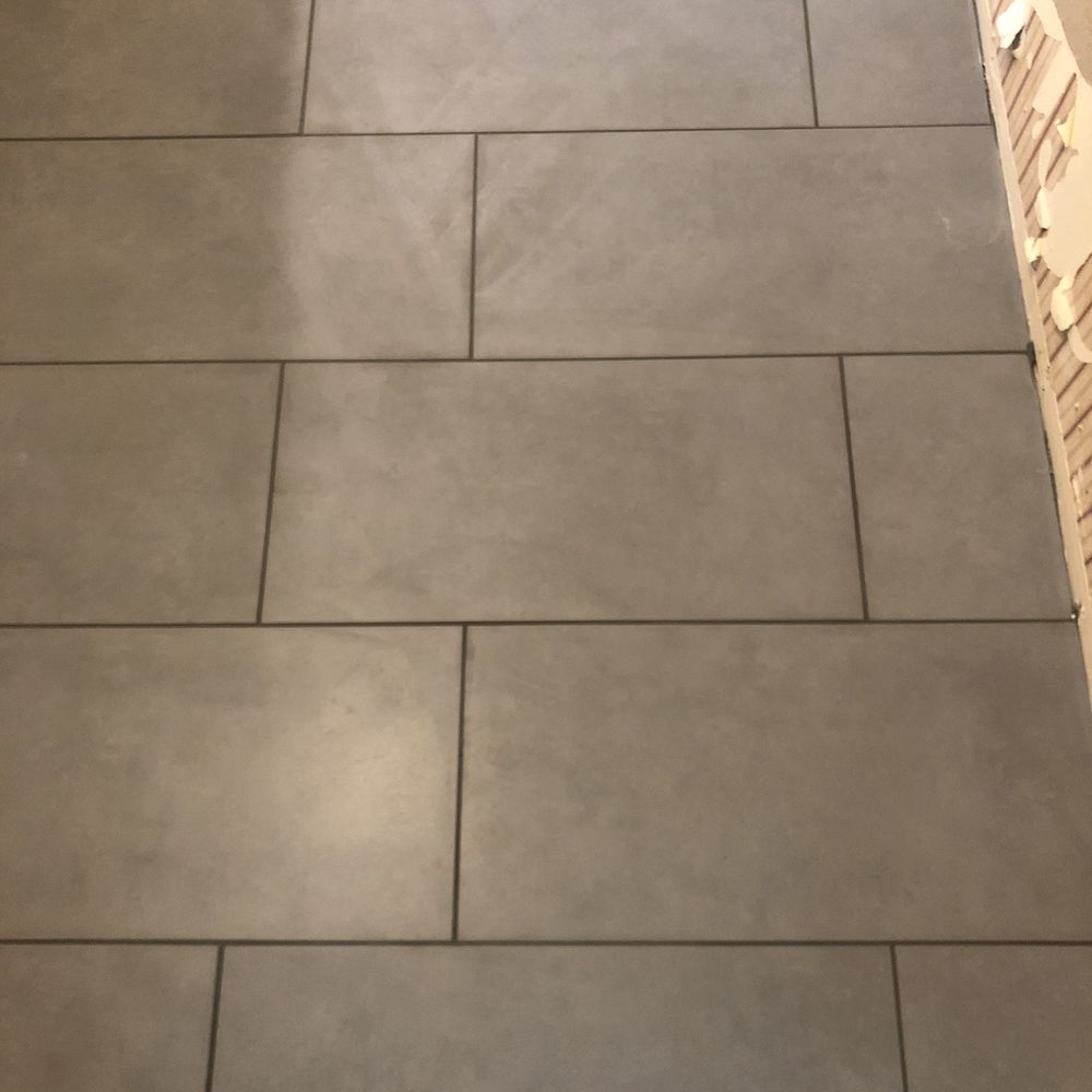 a tile floor being installed a tile floor being installed