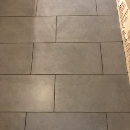 a tile floor being installed