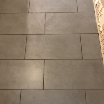 Socal Custom Tile & Design - a tile floor being installed - Flooring Near Me
