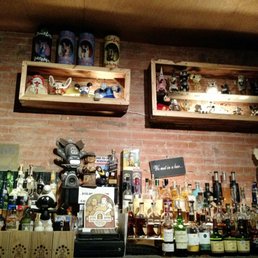 Hmmm  there is a bottle of Vida Mezcal and a bunch of scary figurines on the shelves.  That combination would give me nightmares.