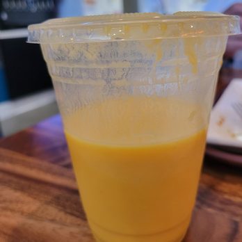 More Curry! - Mango Lassi (this is not a full cup obviously) made fresh each morning.  Generous serving and quite delicious. - Indian Near Me - Corona, California