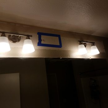 Elite Power and Systems - Went from a fluorescent tube light fixture to two light fixtures (one over each sink). - Electricians Near Me