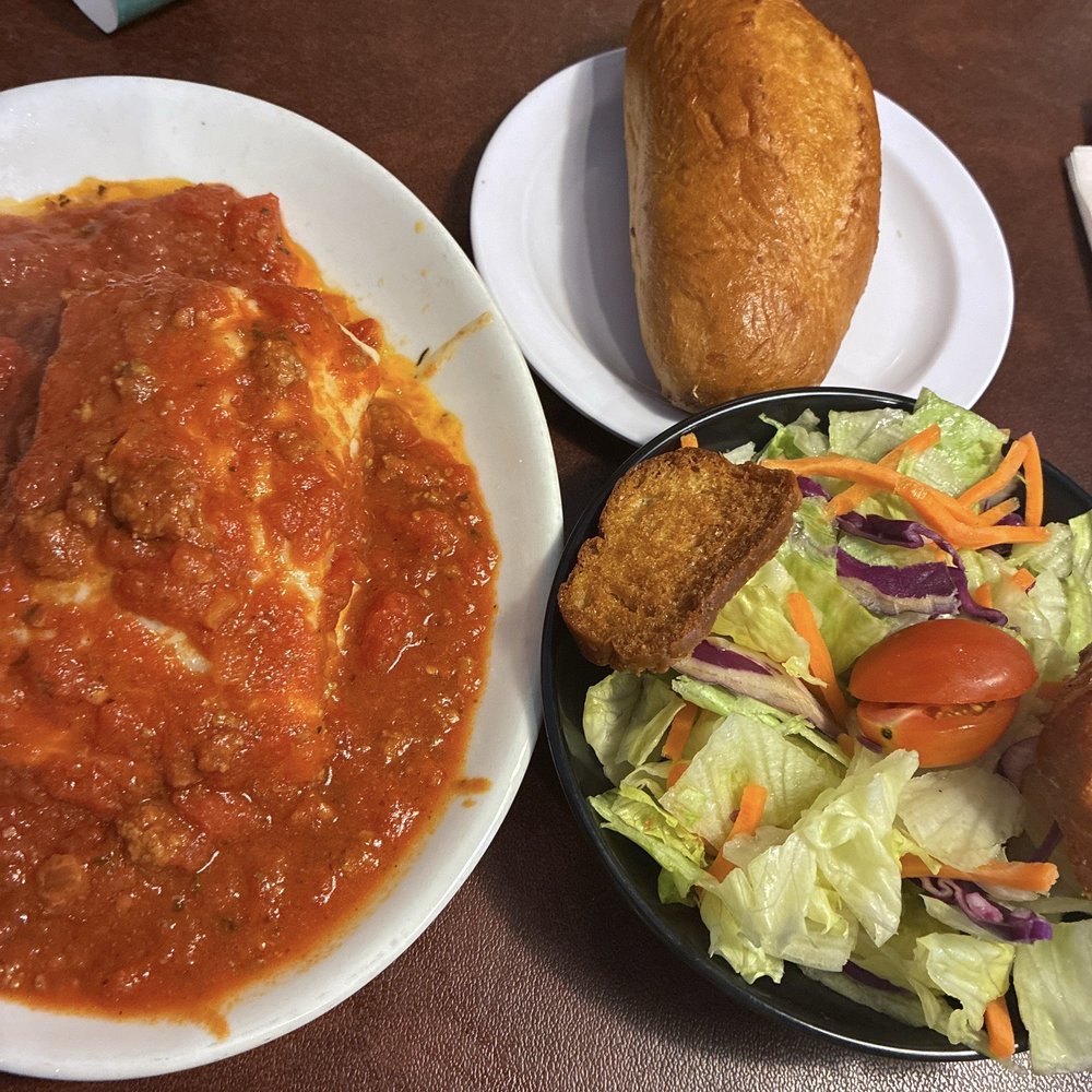 Lasagna, salad and garlic bread Lasagna, salad and garlic bread