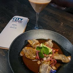 Birria Pot Stickers: braised short rib dumpling, ancho chile consommé, pico and cilantro.