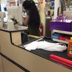 Dollar Tree - Employee ringing me up on her phone, love it!!!