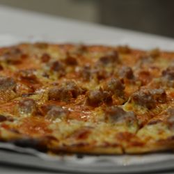 Sam's Pizza-Schofield - Pizzas are cut in to squares not pie shaped. Enjoy the deliciousness!