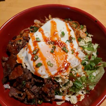 Doc Chey's Noodle House - BiBimBap: korean beef, lettuce, kimchi & sunny-side up egg over rice. drizzled with korean bbq sauce, scallions and sesame seeds - Asian Fusion Near Me - Atlanta, Georgia Doc Chey's Noodle House - BiBimBap: korean beef, lettuce, kimchi & sunny-side up egg over rice. drizzled with korean bbq sauce, scallions and sesame seeds - Asian Fusion Near Me - Atlanta, Georgia
