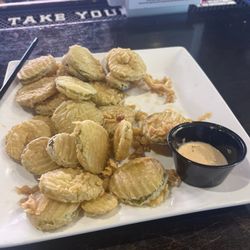 Might As Well Bar & Grill - Half eaten fried pickles. Was a pyramid.