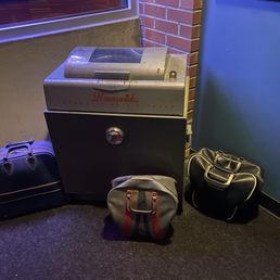two pieces of luggage in a corner