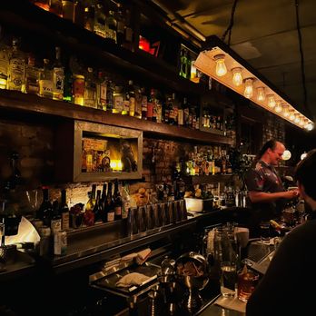 Attaboy - a man behind a bar counter - Cocktail Bars Near Me - New York, New York