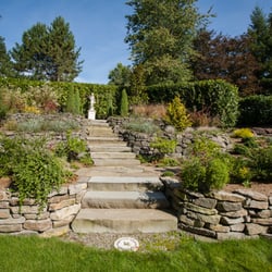 Photo of Closer to Nature Landscape - Seattle, WA, US. Bluestone saw cut treads with Lynch Creek dry stack walls