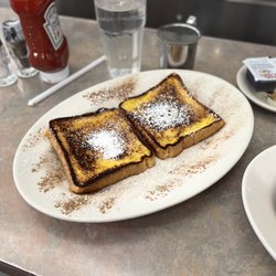 Jackson House - Jackson House Breakfast Combo - French toast with cinnamon and powdered sugar.
