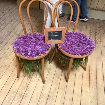 Tangled Garden - two wooden chairs with purple flowers - Herbs & Spices Near Me - Grand Pré, Nova Scotia