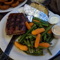 Tom's Place Cafe - Flat iron steak dinner with vegetables and a baked potato