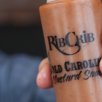 RibCrib BBQ - a hand holding a cold drink - Barbeque Near Me - Garden City, Kansas