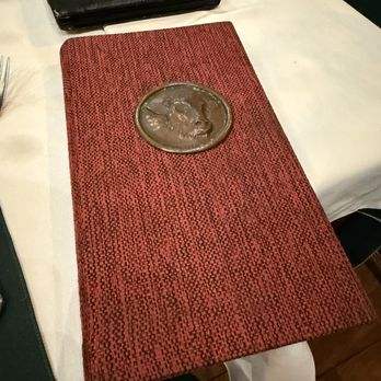 La Brigada - The metal medallion on the menu - Steakhouses Near Me - Buenos Aires, C