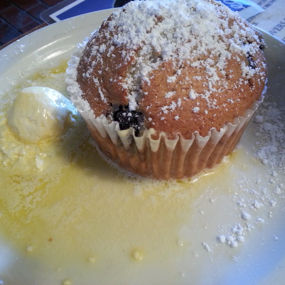 Huckleberry's - Side of Huckelberry muffin with butter - Breakfast & Brunch Near Me - Fairfield, California Huckleberry's - Side of Huckelberry muffin with butter - Breakfast & Brunch Near Me - Fairfield, California