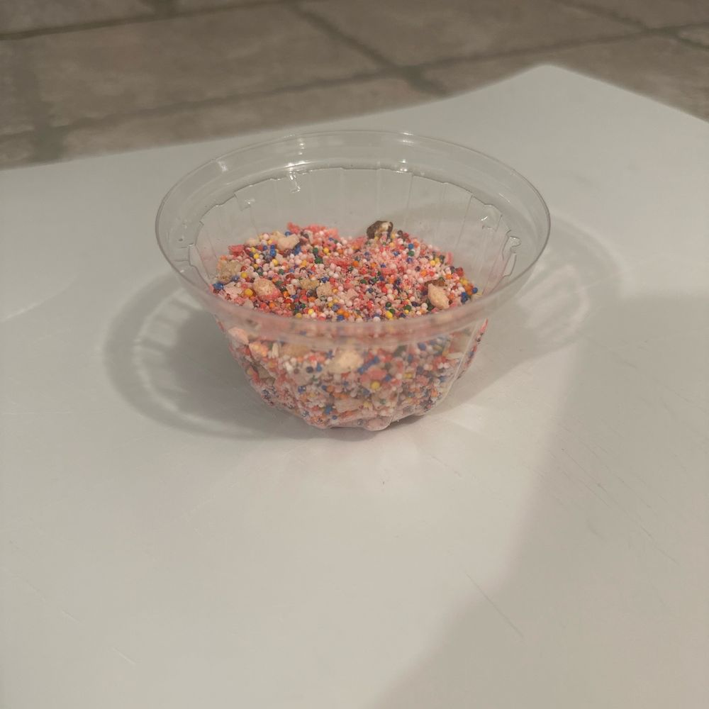 Yogurt Mill - Lid full of cookie sprinkles and walnuts. - Ice Cream & Frozen Yogurt Near Me - Modesto, California Yogurt Mill - Lid full of cookie sprinkles and walnuts. - Ice Cream & Frozen Yogurt Near Me - Modesto, California