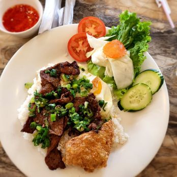 Que Huong Bistro - Com tam bo nuong (broken rice with lemon grass beef) with an egg and tau hu ky (fried shrimp paste) - Vietnamese Near Me - Houston, Texas Que Huong Bistro - Com tam bo nuong (broken rice with lemon grass beef) with an egg and tau hu ky (fried shrimp paste) - Vietnamese Near Me - Houston, Texas