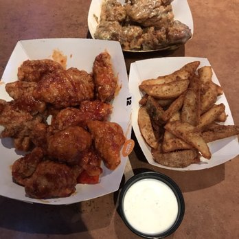 Buffalo Wild Wings - buffalo wings and a bowl of ranch dressing - Chicken Wings Near Me - Derby, Kansas Buffalo Wild Wings - buffalo wings and a bowl of ranch dressing - Chicken Wings Near Me - Derby, Kansas