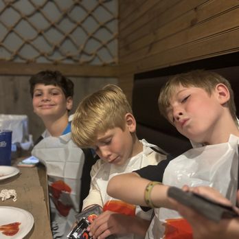 Crafty Crab of Mobile - Happy boys in their bibs! - Seafood Near Me - Mobile, Alabama