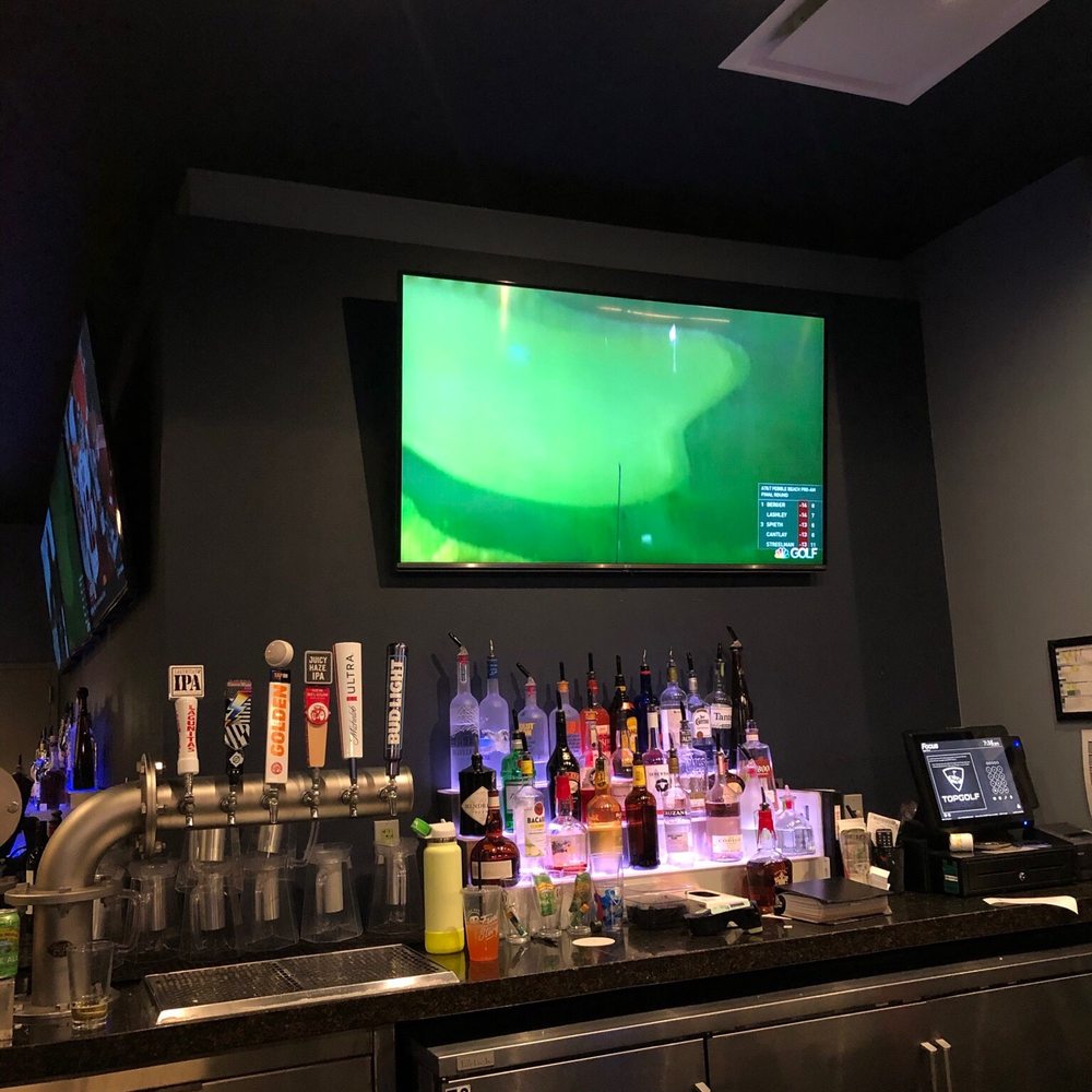 Topgolf - a bar with a large screen tv - Golf Near Me - Gilbert, Arizona Topgolf - a bar with a large screen tv - Golf Near Me - Gilbert, Arizona