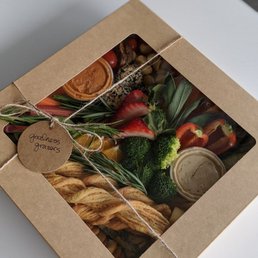 a variety of food wrapped in brown paper a variety of food wrapped in brown paper