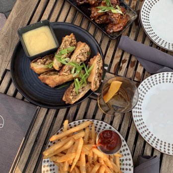 M.Bird Rooftop Restaurant & Lounge - Truffle fries, jerk chicken eggrolls, gochujang wings - Cocktail Bars Near Me - Tampa, Florida M.Bird Rooftop Restaurant & Lounge - Truffle fries, jerk chicken eggrolls, gochujang wings - Cocktail Bars Near Me - Tampa, Florida
