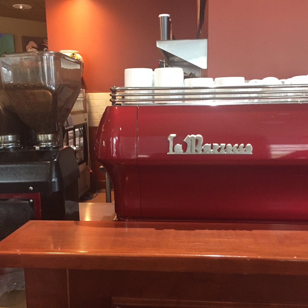 Caffè Artigiano - a red coffee machine - Coffee & Tea Near Me - Calgary, Alberta Caffè Artigiano - a red coffee machine - Coffee & Tea Near Me - Calgary, Alberta