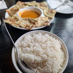 Scallion pancakes and rice for the table. Scallion pancakes and rice for the table.