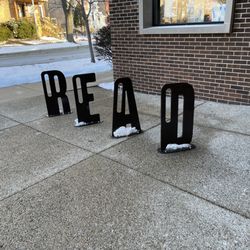 Chicago Public Library - Jefferson Park Branch - Library-appropriate artwork outside in the plaza.