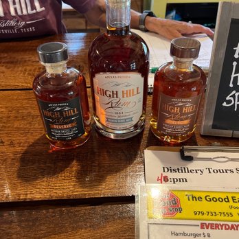 High Hill Distillery - bottles of whiskey and a menu - Distilleries Near Me - Hallettsville, Texas