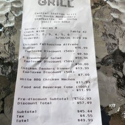 Corrected receipt- which we should not have to pay anything because we left our entire meals. Roach crawling up behind us on the wall.