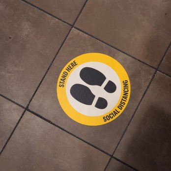 McDonald's - a person standing on a tiled floor - Fast Food Near Me - Titusville, Florida